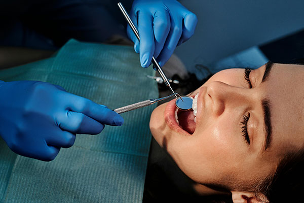 A person receiving treatment from a periodontist in NYC