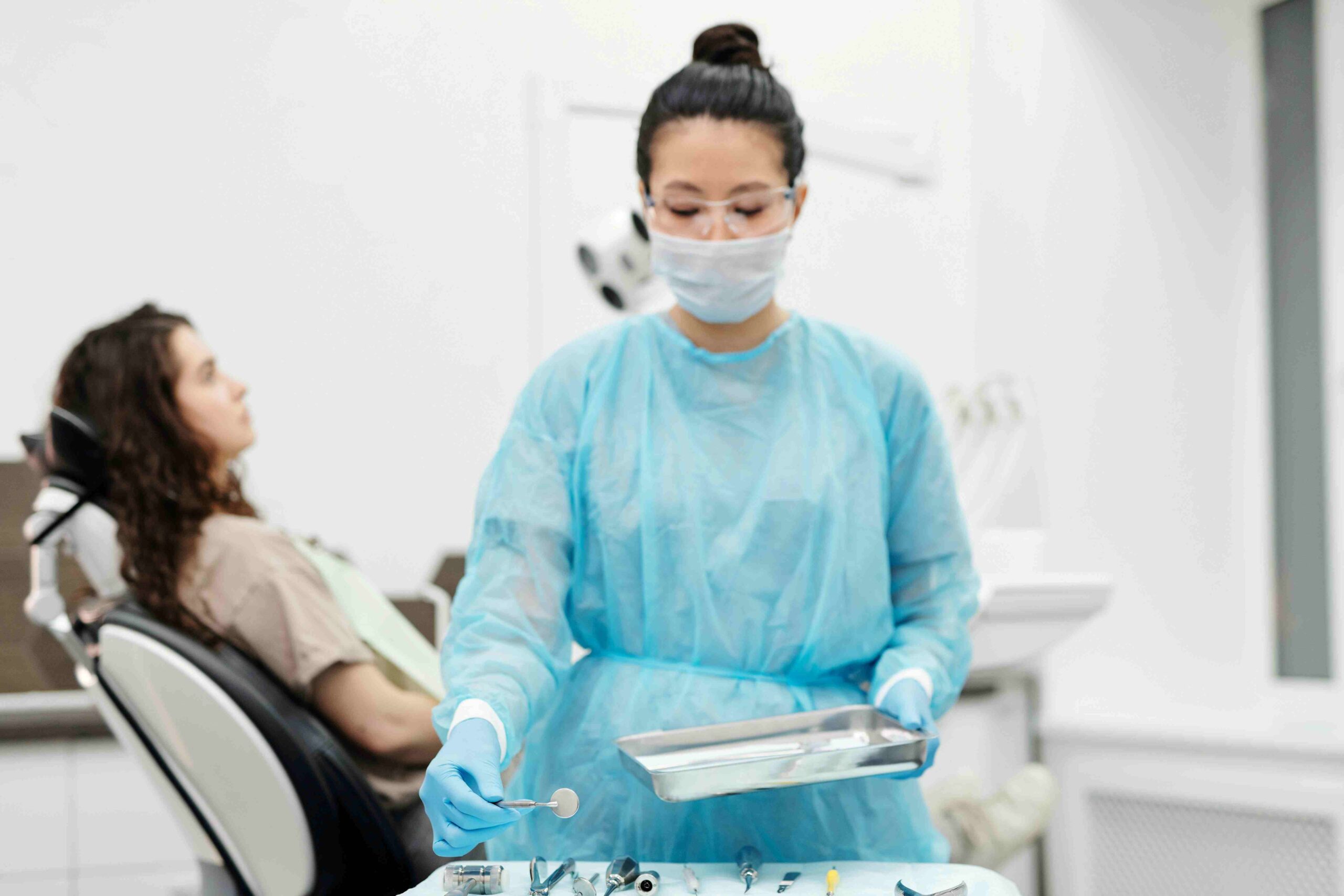 A professional preparing to perform a wisdom tooth extraction in NYC